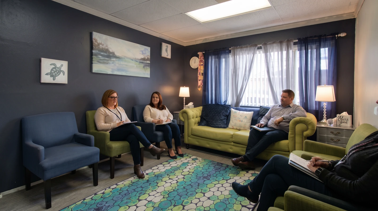 Outpatient group session in a comfortable office setting.