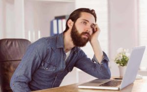 bored hipster at desk