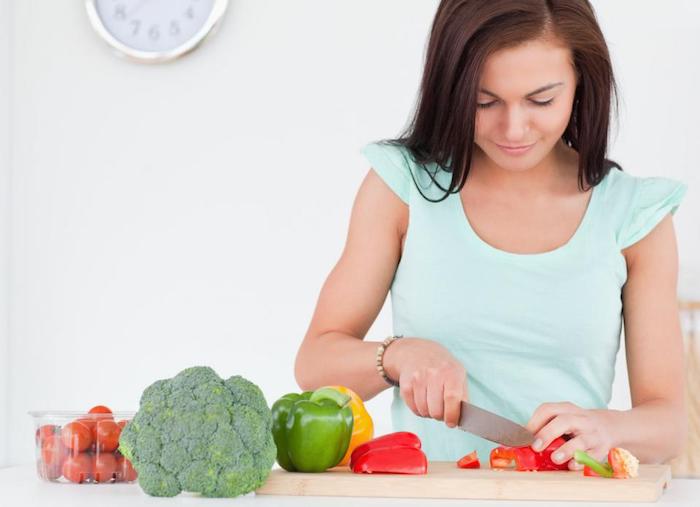woman with veggies in recovery from addiction