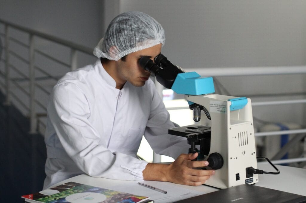 man determining contents of blue fentanyl in a lab_