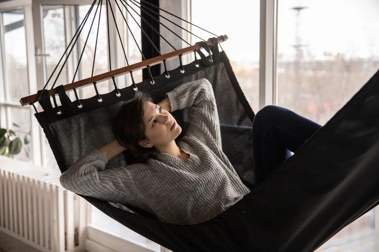 woman on cot practicing mindfulness