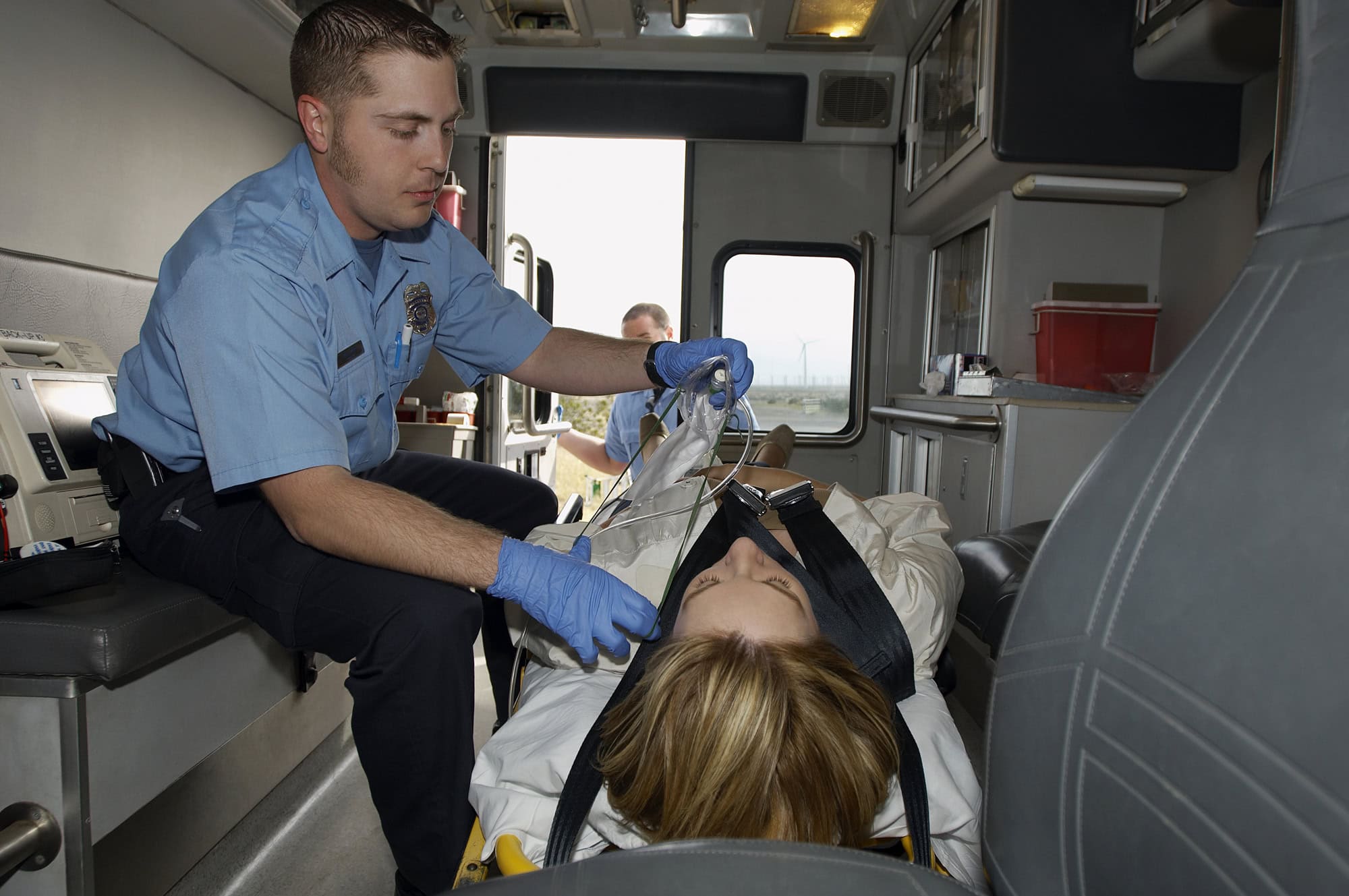 paramedics assisting overdose victim after naloxone